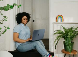 Omegle TV: Live Video Chat at Your Fingertips a woman sitting on the floor using a laptop