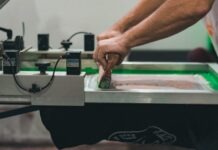 Coventry’s Best T-Shirt Printing Services: How Woven Inc Leads the Market a person working on a machine