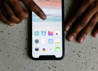 Why is it Important to Have a Celebrity Presence on Instagram? Close-up view of hands interacting with social media apps on a smartphone screen.