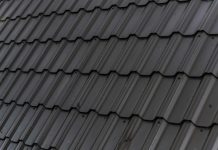 Spotting The Most Common Issues With Your Roofing a close up of a roof with a black shinnel