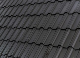 Spotting The Most Common Issues With Your Roofing a close up of a roof with a black shinnel