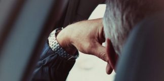 person wearing silver and gold bracelet