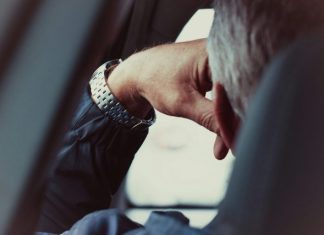 person wearing silver and gold bracelet