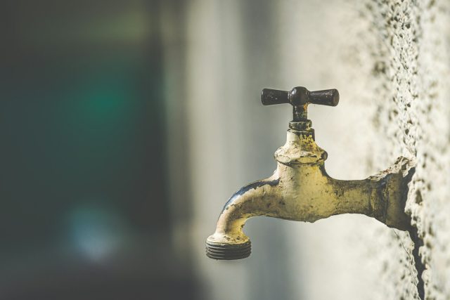 Photo by Patrick Pahlke brass faucet with water droplets