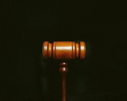 brown wooden stand with black background