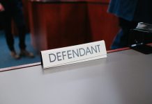 a desk with a sign on it that says defend