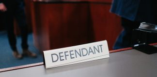 a desk with a sign on it that says defend