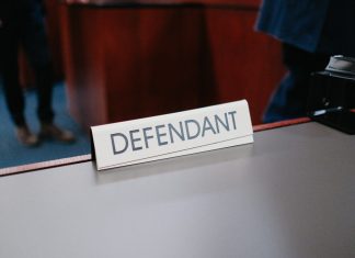 a desk with a sign on it that says defend