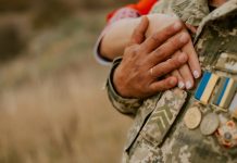 The Military Divorce Decisions That Actually Shape Your Life After Uniform a close-up of hands holding coins