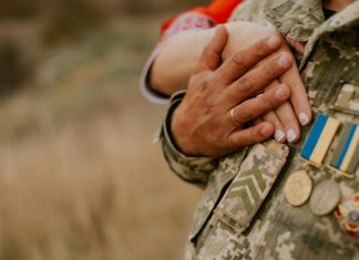 a close-up of hands holding coins