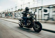 Must-Have Riding Gear for Every Motorcyclist person riding motorcycle on concrete road