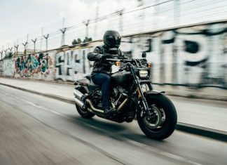 Must-Have Riding Gear for Every Motorcyclist person riding motorcycle on concrete road